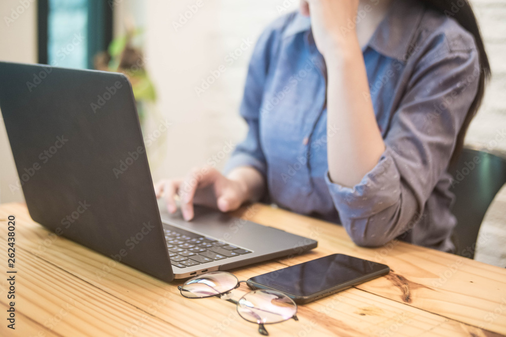 Young woman working on laptop in the cafe. working woman concept. Young woman working on laptop in the cafe. working woman concept.