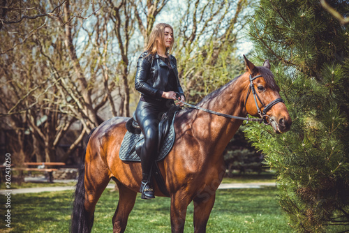 Rider elegant woman talking to her horse. Portrait of horse pure breed with woman. Equestrian horse with rider playpen for horses background  © T.Den_Team
