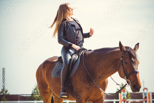 Rider elegant woman talking to her horse. Portrait of horse pure breed with woman. Equestrian horse with rider playpen for horses background 