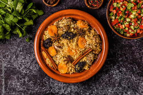 Traditional moroccan tajine of chicken with dried fruits and spices.