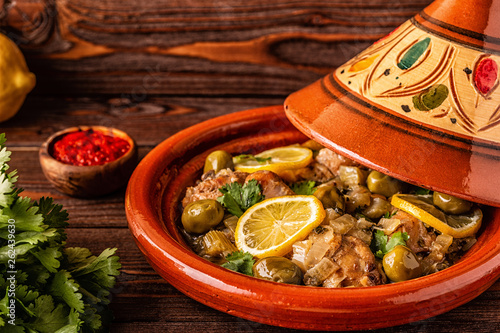 Traditional Moroccan chicken tagine with olives and salted lemons photo