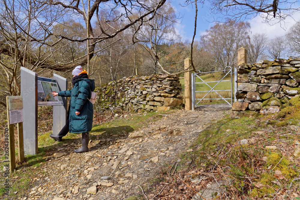 Tourist at the entrance on a tourist trail in the mountains of Snowdonia. Wales, UK
