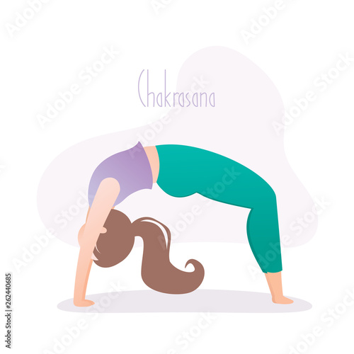 Girl doing yoga pose, wheel pose or chakrasana asana in hatha yoga photo