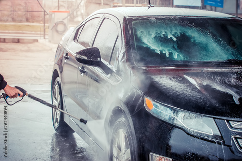 Car washing. Cleaning Car Using High Pressure Water. 