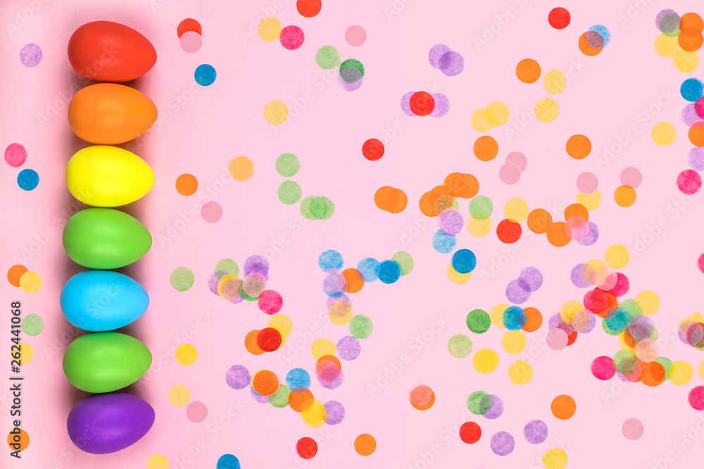 Colored Easter eggs on pink background. Flatlay. Colored Easter eggs on pink background. Flatlay.