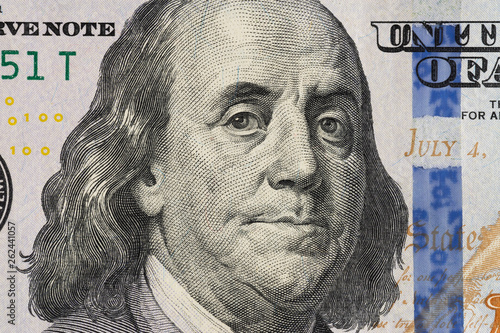 Closeup photo of a 100 dollar bill. 