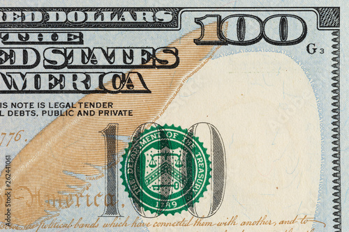 Closeup photo of a 100 dollar bill. 