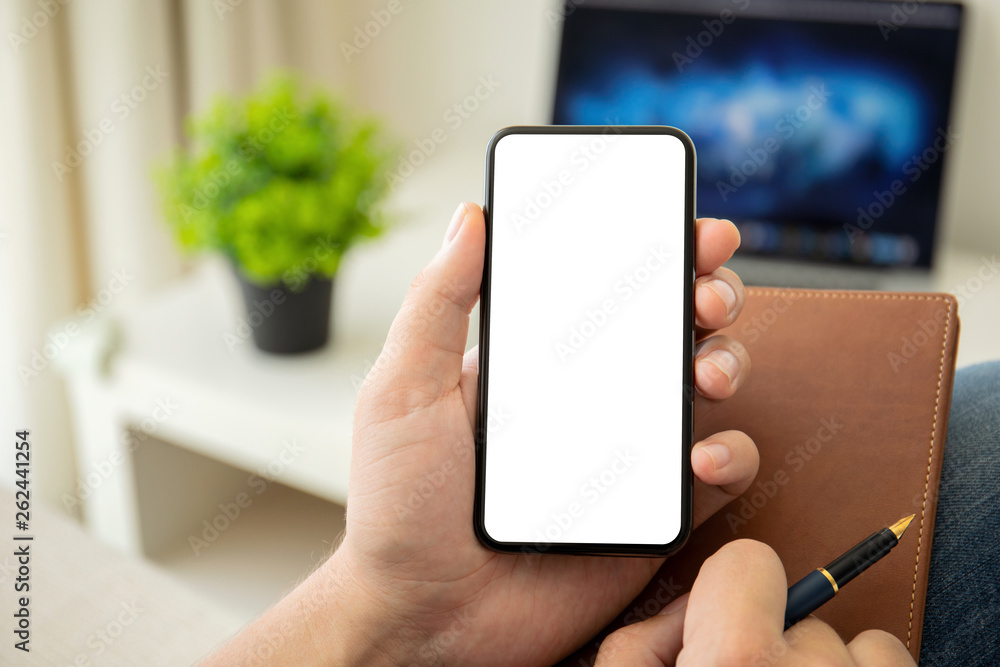 man hands holding phone with isolated screen in the room