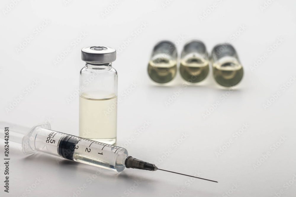Subcutaneous syringe. Syringes with blue needles. Medical Injectors ...