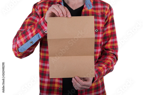 A man holding booklet