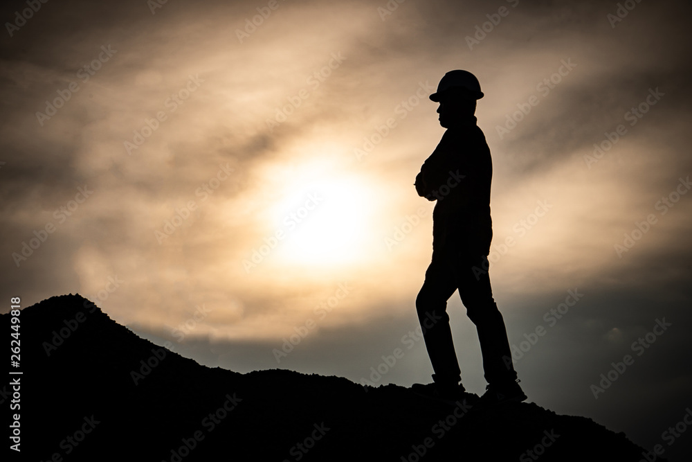 Concept Labor Day: Labor man standing with a warm sunset light Concept Labor Day: Labor man standing with a warm sunset light