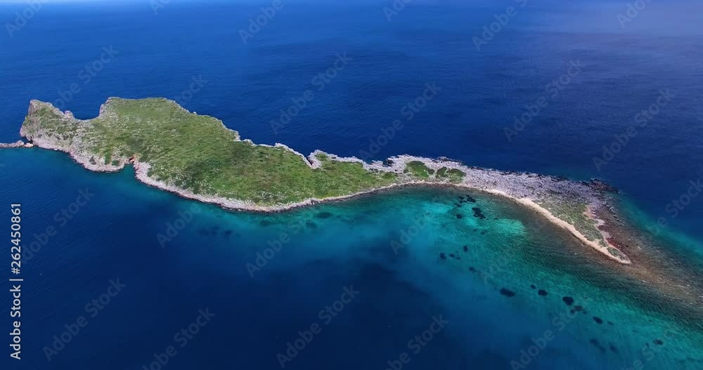 Flying Over Island Kolokitha beach yacht sailing far from shore, early morning in Kolokitha island, Crete, Greece. Flying Over Island Kolokitha beach yacht sailing far from shore, early morning in Kolokitha island, Crete, Greece.