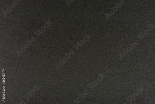 Black gradient color with texture from real foam sponge paper for background, backdrop or design.