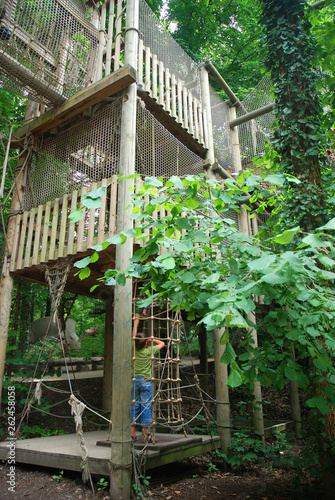 Climbing tower for kids in the forest adventure park