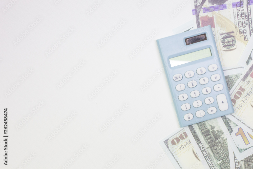 blue calculator and banknotes on white back ground. blue calculator and banknotes on white back ground.