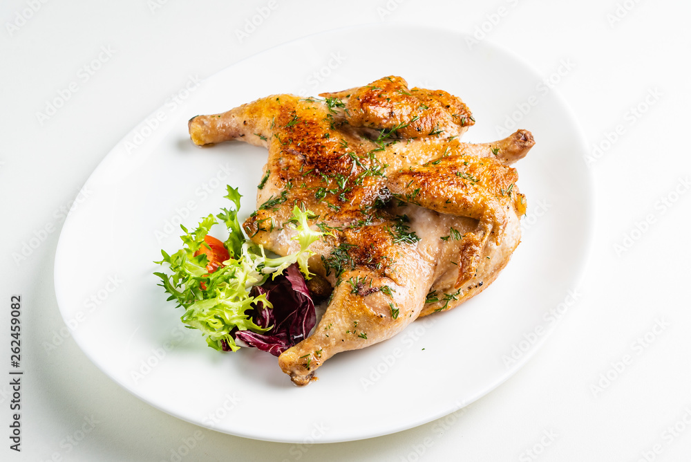 Grilled Chicken tobacco on the white plate Grilled Chicken tobacco on the white plate