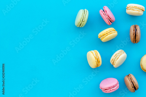 Wallpaper Mural Brignt macarons for sweet break on blue background top view mock up Torontodigital.ca