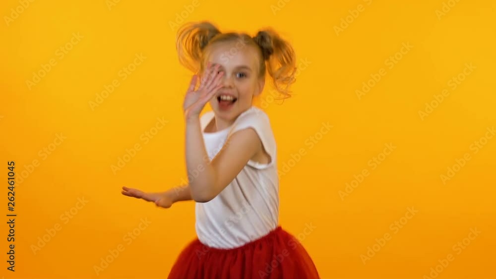 Funny active girl posing and dancing before camera, little model, slow motion Funny active girl posing and dancing before camera, little model, slow motion