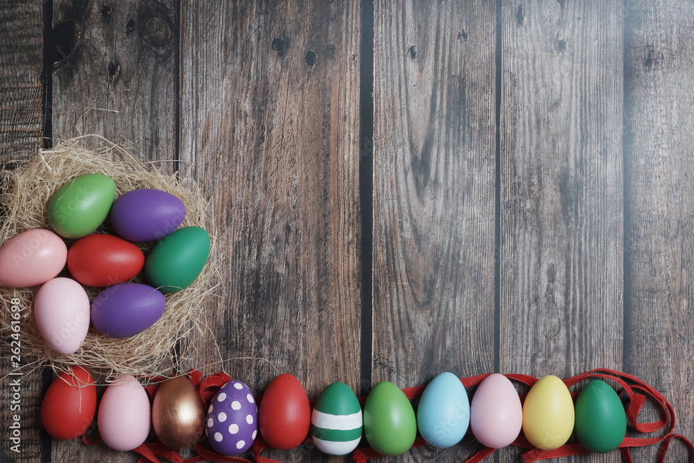 Flat-lay colorful Easter eggs on wooden table copy-space. Flat-lay colorful Easter eggs on wooden table copy-space.