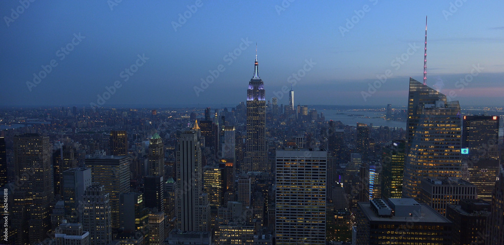 Fototapeta premium New York, Usa:Aerial view of Manhattan midtown and downtown skyscrapers ar sunset and dusk time