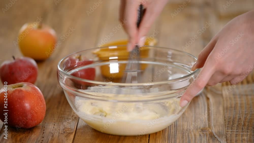 Chef adding egg to butter, cooking dough on the kitchen Chef adding egg to butter, cooking dough on the kitchen