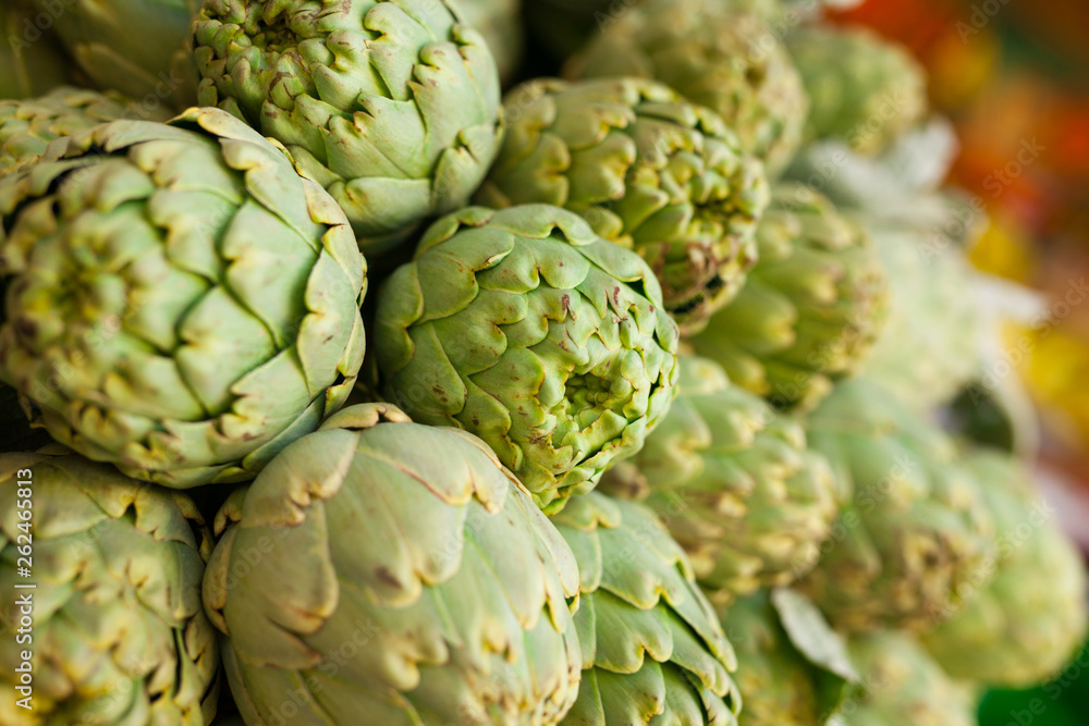 Fototapeta premium Fresh artichokes on market counter