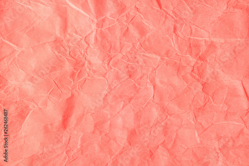 Crumpled orange-pink craft paper