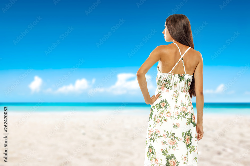 Summer time on beach and slim young woman 