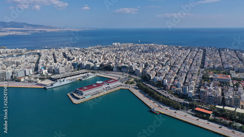 Aerial drone bird s eye view of famous crowded port of Piraeus one of the largest in Europe where ships travel to popular Aegean destinations  Attica  Greece