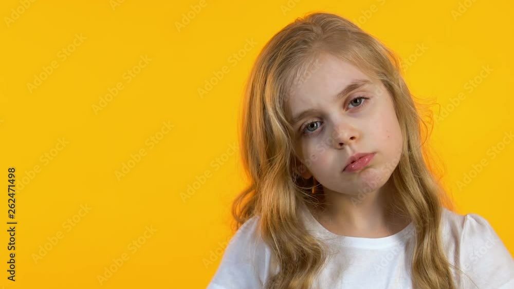Sad schoolgirl making facepalm, tired of hard school lessons, vitamin deficiency Sad schoolgirl making facepalm, tired of hard school lessons, vitamin deficiency
