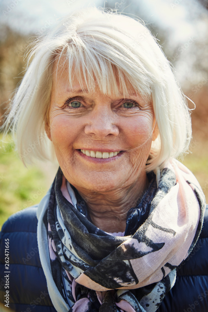 Happy senior woman smiling to camera Happy senior woman smiling to camera