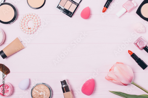 Festive flat layout of decorative feminine cosmetics