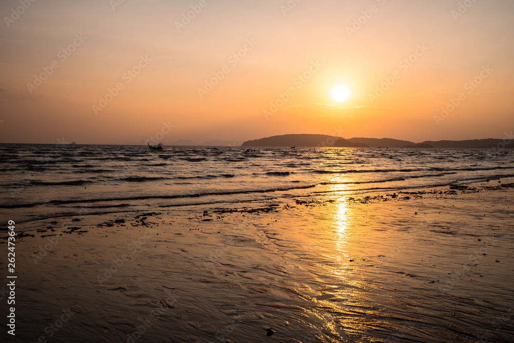 Panoramic photo of beautiful sunset over the sea, sun goes behind the mountain. Golden colors Panoramic photo of beautiful sunset over the sea, sun goes behind the mountain. Golden colors