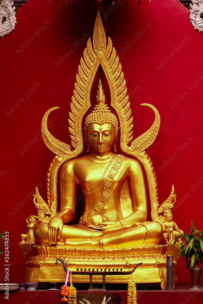 Fototapeta premium Beautiful Statue of Buddha on red background in thailand. Buddhism.