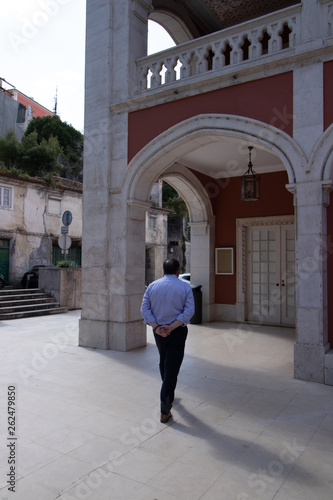 man walking on the street in front of the old house in Sintra © Artur Gomes