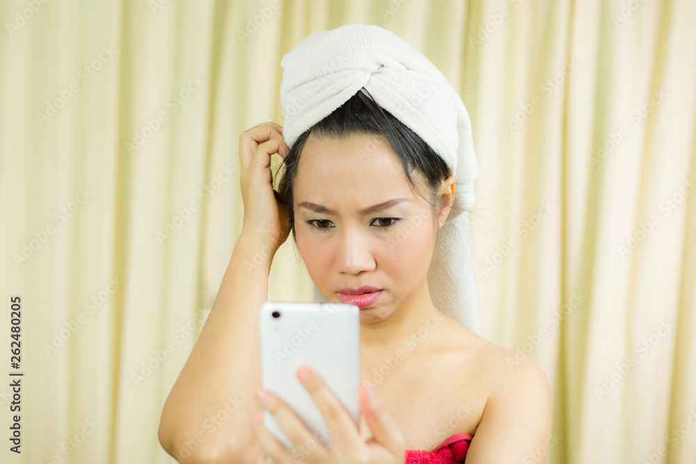 woman acting playing on phone. she wear a skirt to cover her breast after wash hair, Wrapped in Towels After Shower woman acting playing on phone. she wear a skirt to cover her breast after wash hair, Wrapped in Towels After Shower