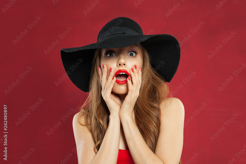 Excited woman with opened mouth on red background. Perfect model girl Excited woman with opened mouth on red background. Perfect model girl