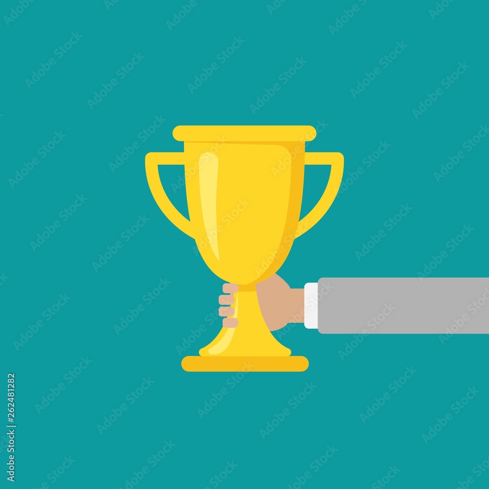 Hand with gold trophy, winning cup isolated on blue background. First place, award bowl. Hand with gold trophy, winning cup isolated on blue background. First place, award bowl.