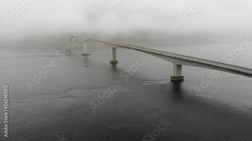 Aerial view. Bridge over fjord on Lofoten islands. Summer time, foggy hazy day, overcast weather photo