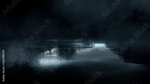Dark street and wet asphalt. Night view of the city, reflection of the glare in the water, neon blue light. Dark street background.