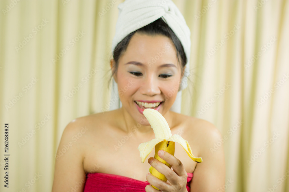 woman holding banana acting smile, sad, funny, wear a skirt to cover her breast after wash hair, Wrapped in Towels After Shower woman holding banana acting smile, sad, funny, wear a skirt to cover her breast after wash hair, Wrapped in Towels After Shower