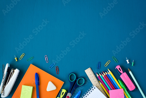 Top view of school supplies and office supplies on blue background.  Learning, study, office equipment and presentation concept. 9505301 Stock  Photo at Vecteezy