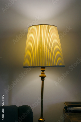 Old retro lamp shines in a classic interior. Old lampshade shines through a beautiful light