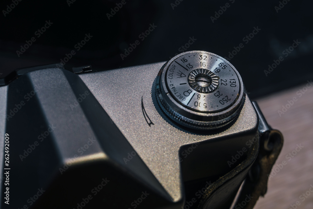 control levers and castors of an old film camera made entirely from metal of beautiful metallic and black color close up control levers and castors of an old film camera made entirely from metal of beautiful metallic and black color close up