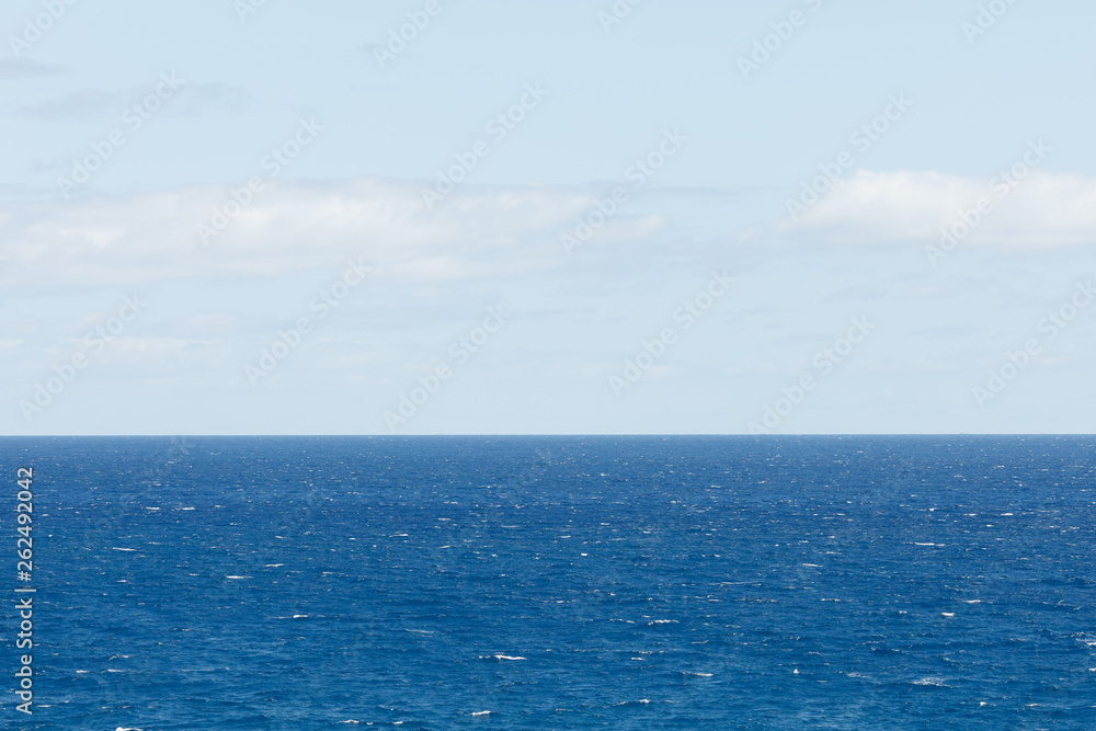 blue Atlantic Ocean background at sunny day