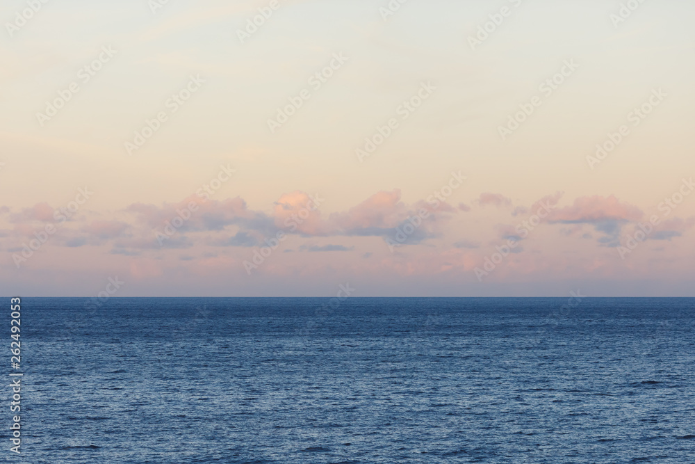 blue Atlantic Ocean background at sunset