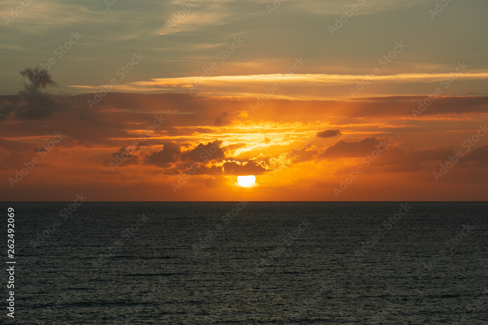 sunset at ocean seascape with clouds