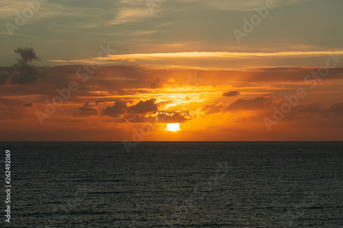 sunset at ocean seascape with clouds