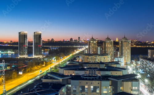 aerial view to night capital of Ukraine with road traffic and night lights