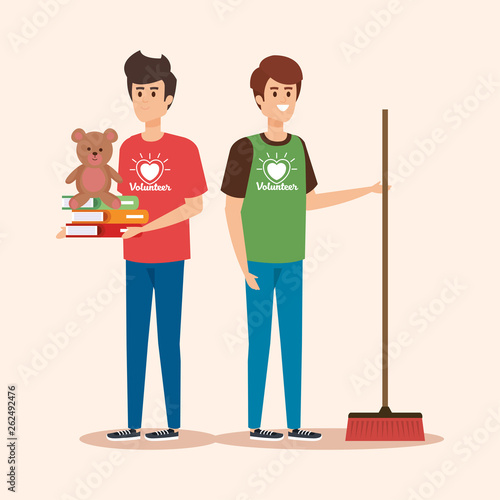 boys with broom and books with teddy donation